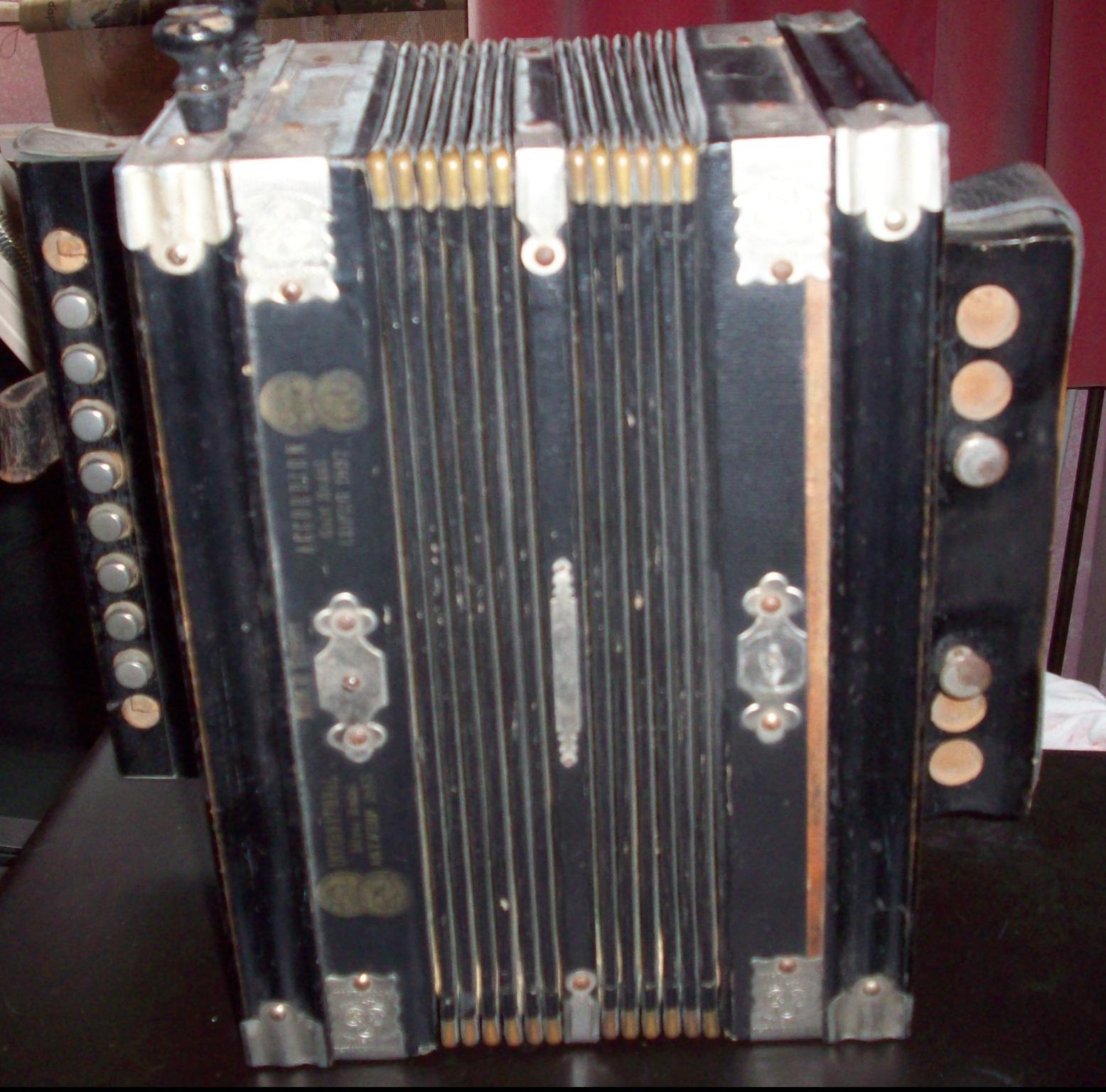 Single row 4 stop, 2 bass German melodeon